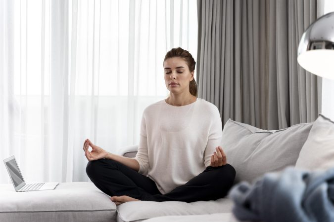young-woman-practicing-yoga-relax